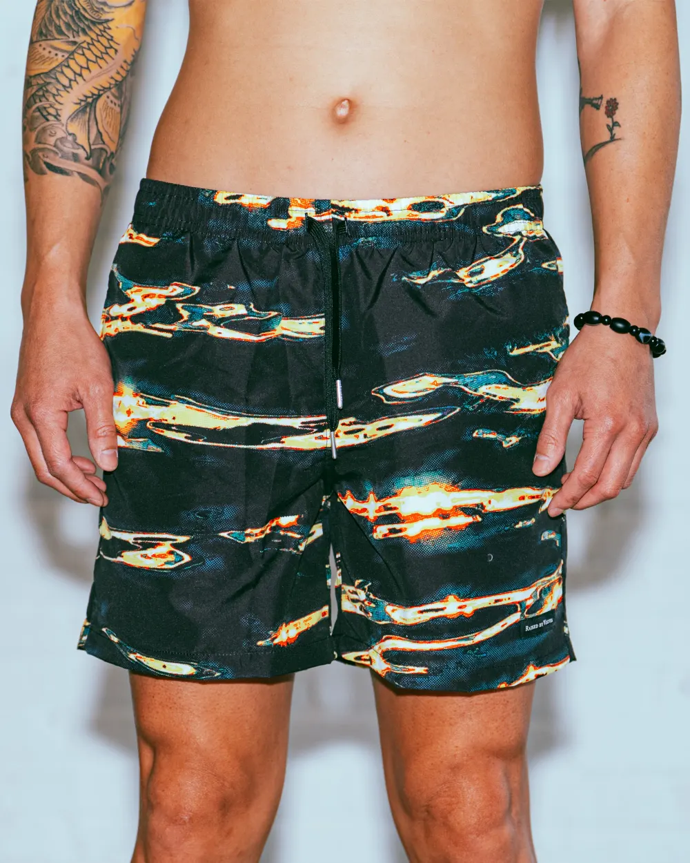 Tiger Shark Swim Trunks from Raised by Wolves